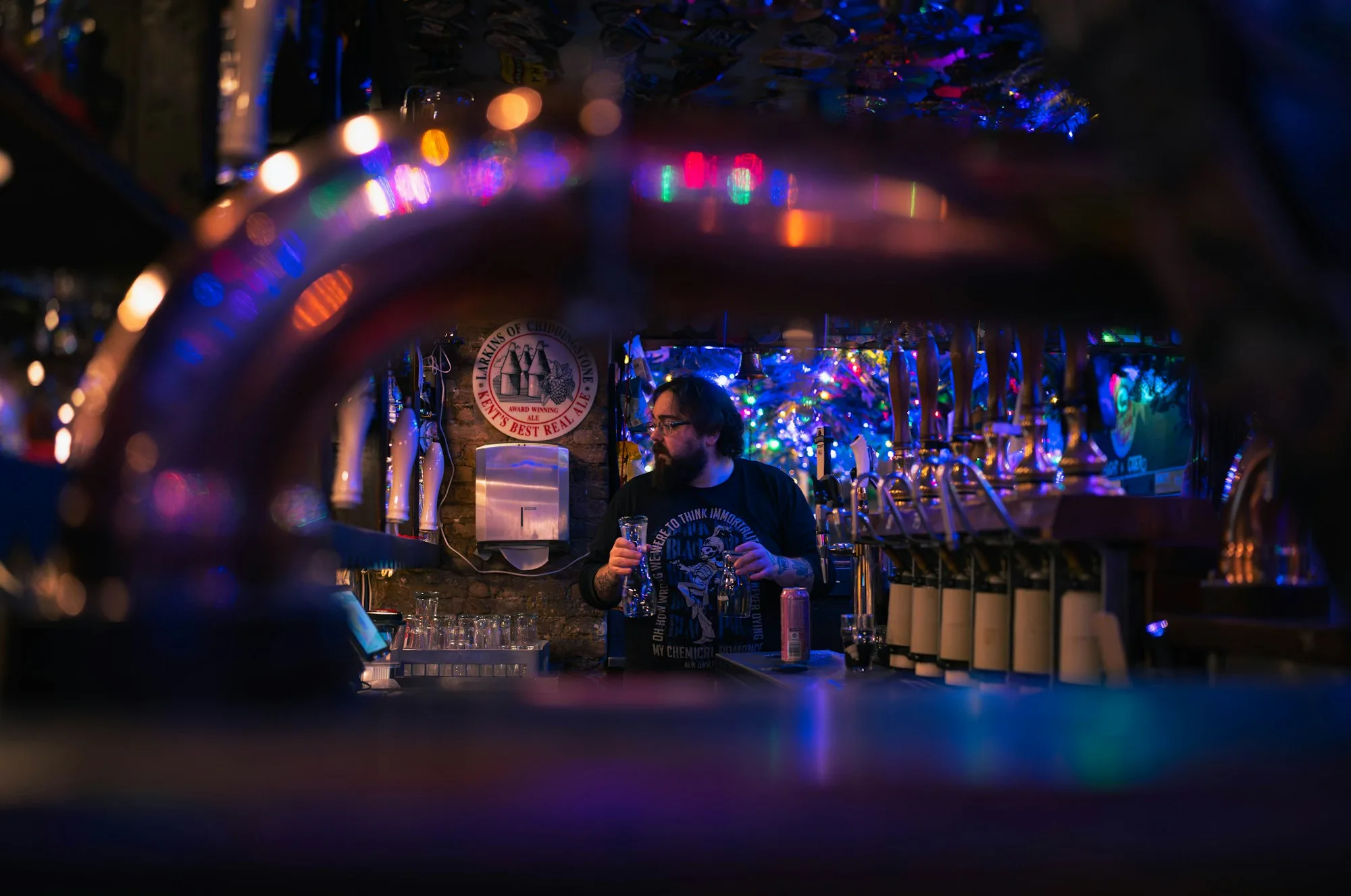 Bartender at work in a low-lit bar