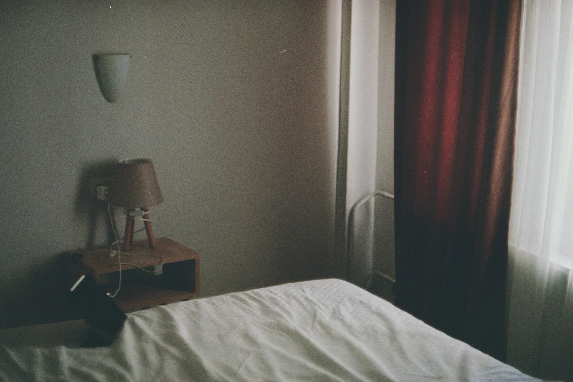 An understated hotel room photographed on film